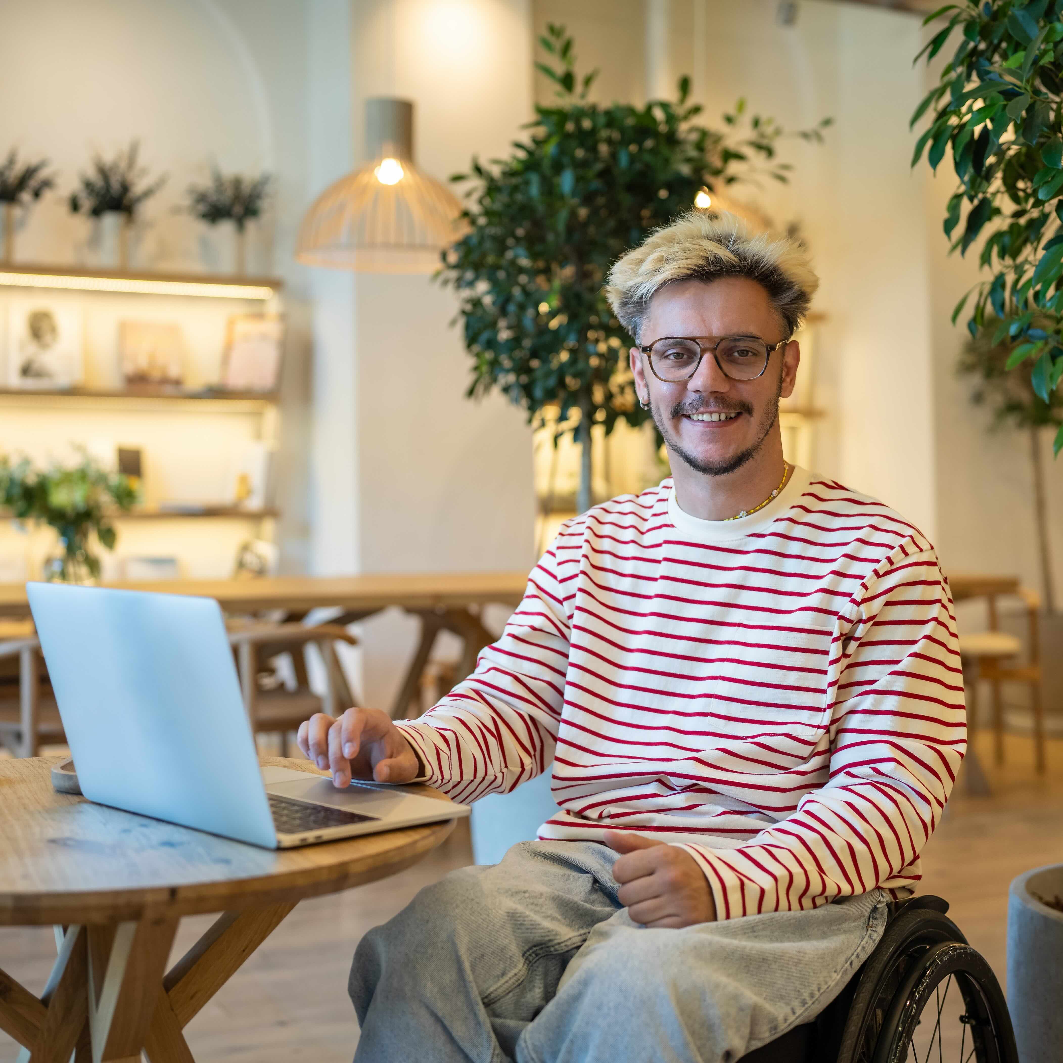 Person using a wheelchair smiling confidently